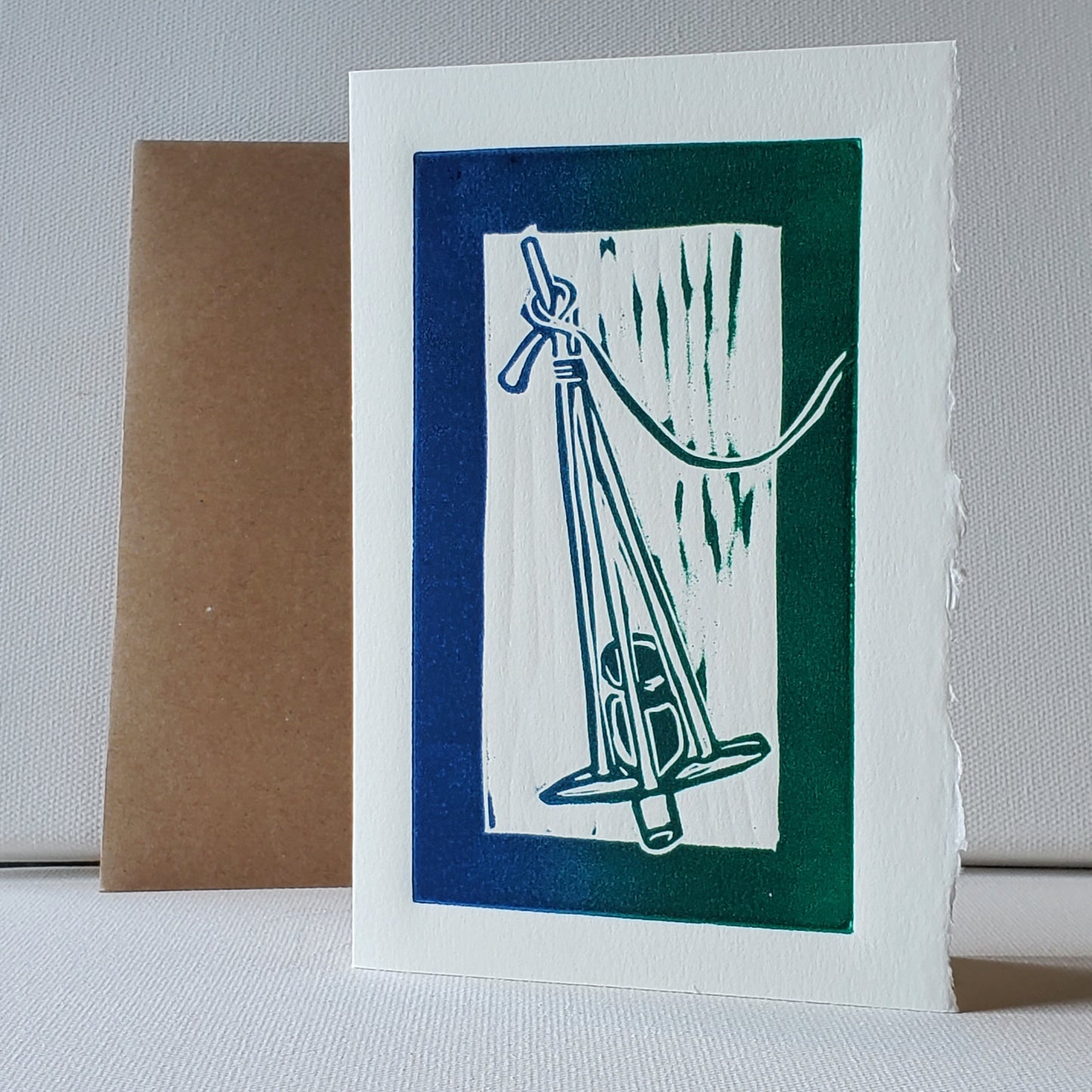 Norton's Cove Card Killick design in blue-green rainbow roll ink