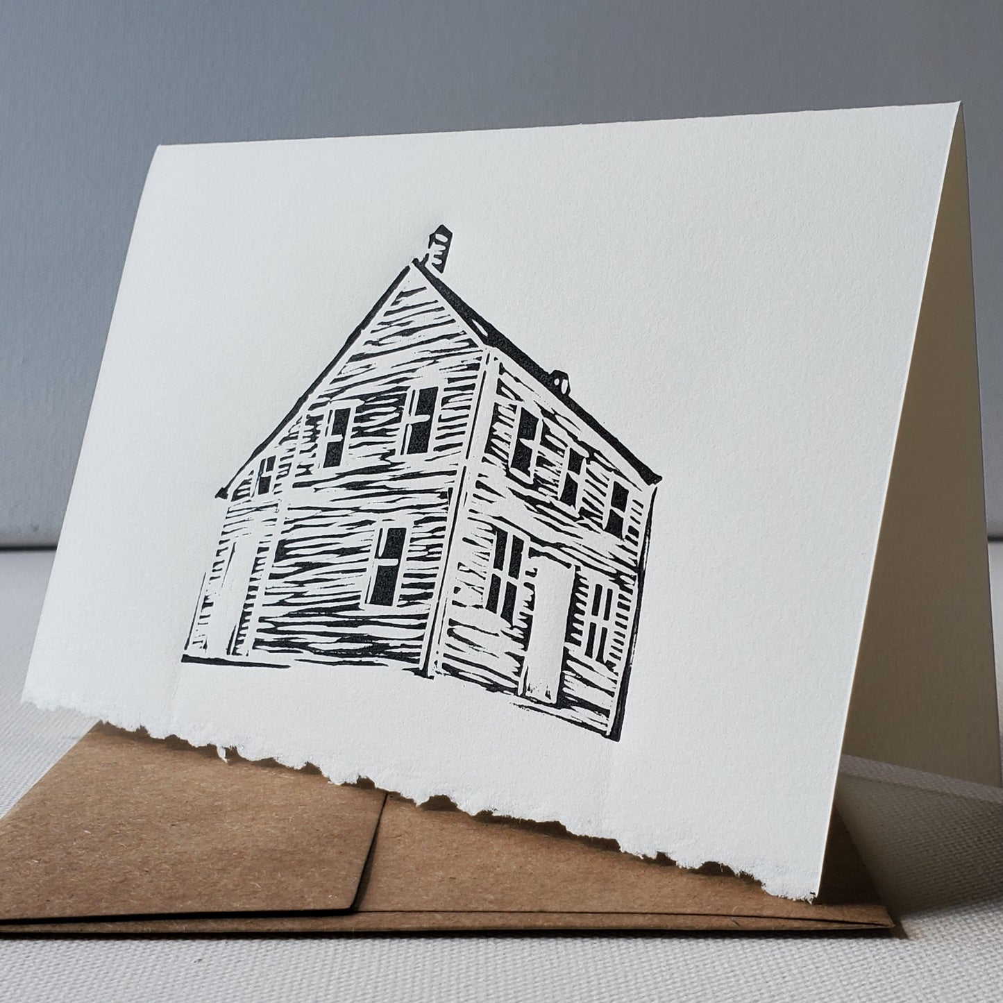 Janet Davis' Saltbox house design, inspired by a home in Greenspond, relief printed in black ink