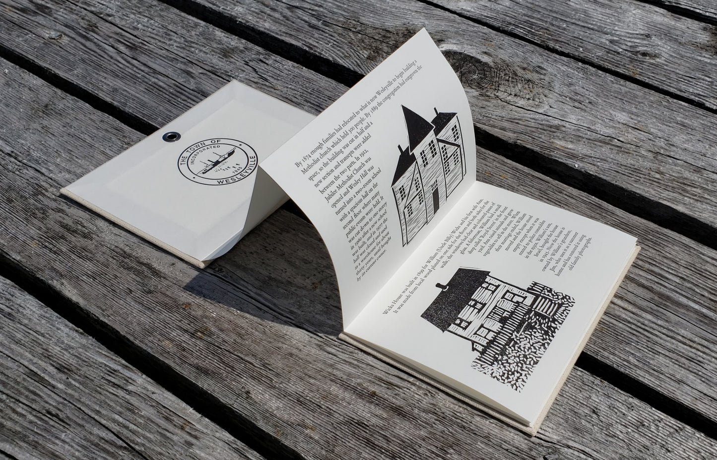 Inside cover, 2nd & 3rd pages of Wesleyville artists' book, photographed at dock in Wesleyville