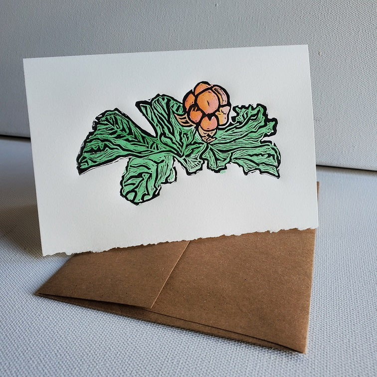 Bakeapple card standing on Kraft envelope