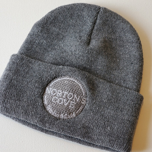Grey toque with Norton's Cove Studio & Café logo embroidered on the rolled cuff in white thread.