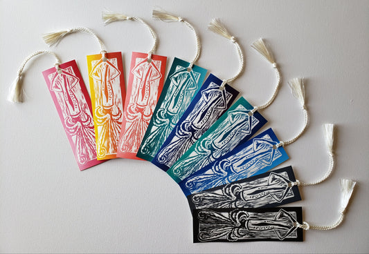 Squid Bookmarks in the full range of a usual print run: red, red-yellow, orange, green, red-blue, blue -green, blue, grey, & black.