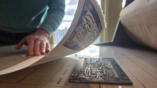A Tea for Two teacup print being lifted from its inked printing plate at Norton's Cove Studio.