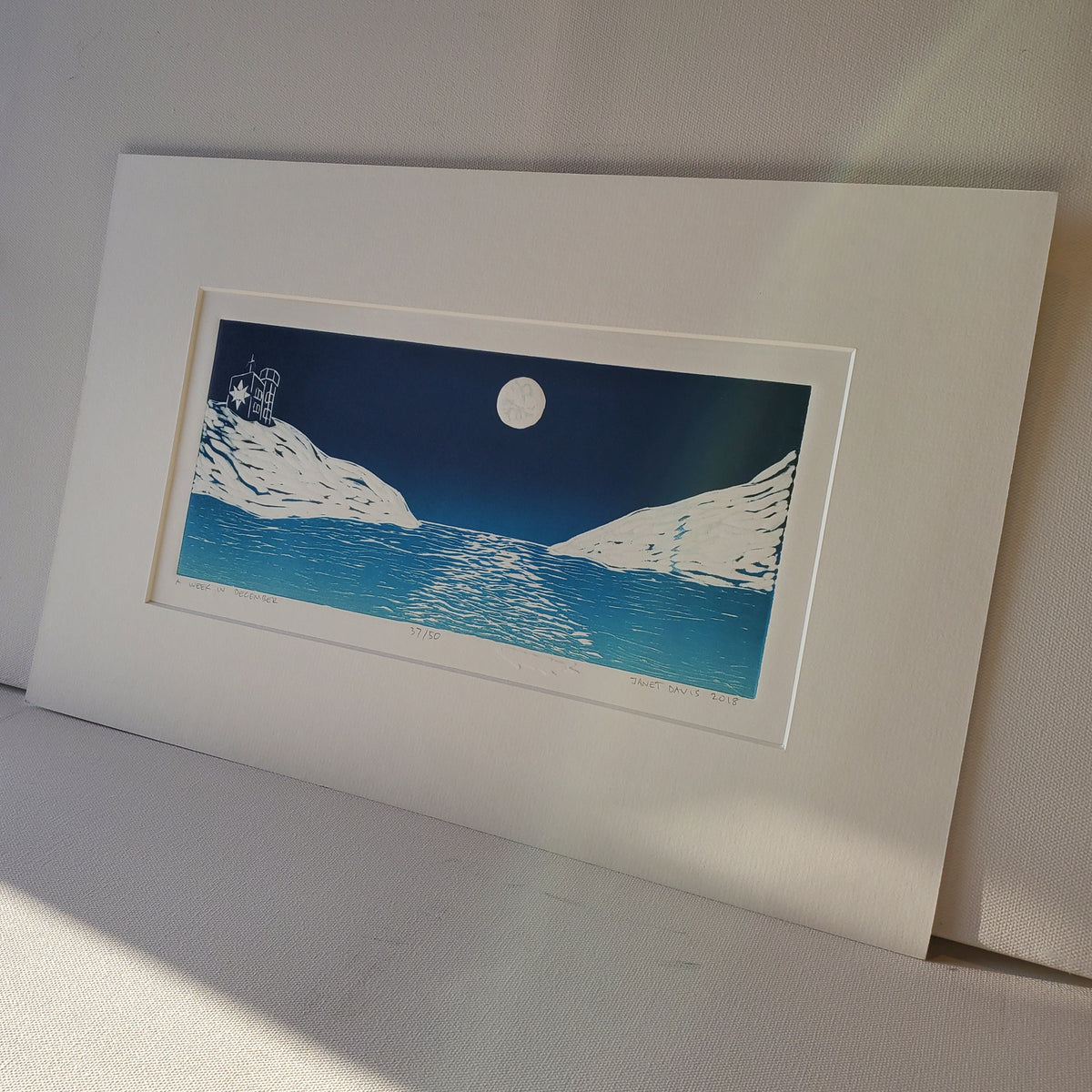 A Week in December © Janet Davis 2018, Blue-White Rainbow Roll, original linocut impression with capelin shop chop
