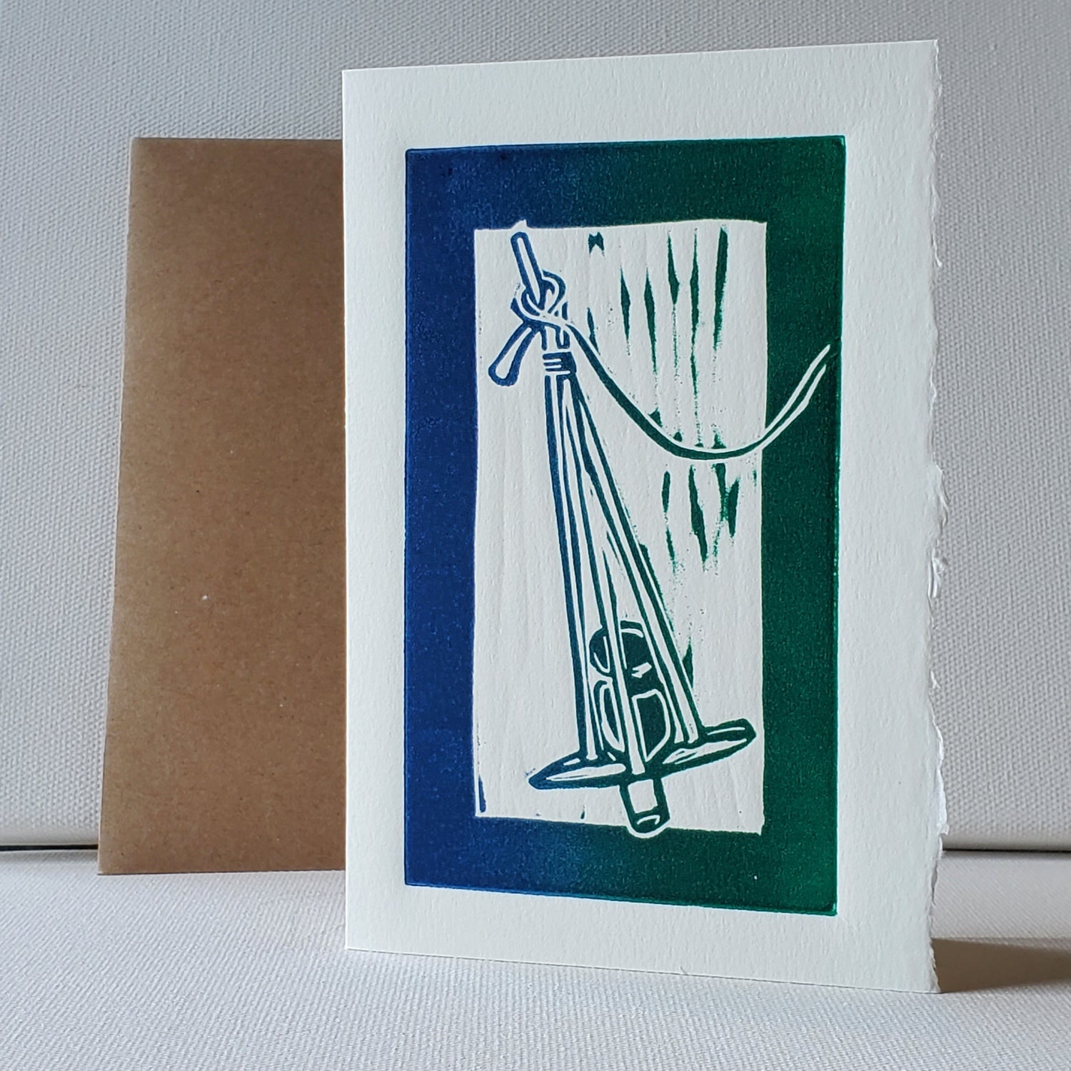 Norton's Cove Card Killick design in blue-green rainbow roll ink