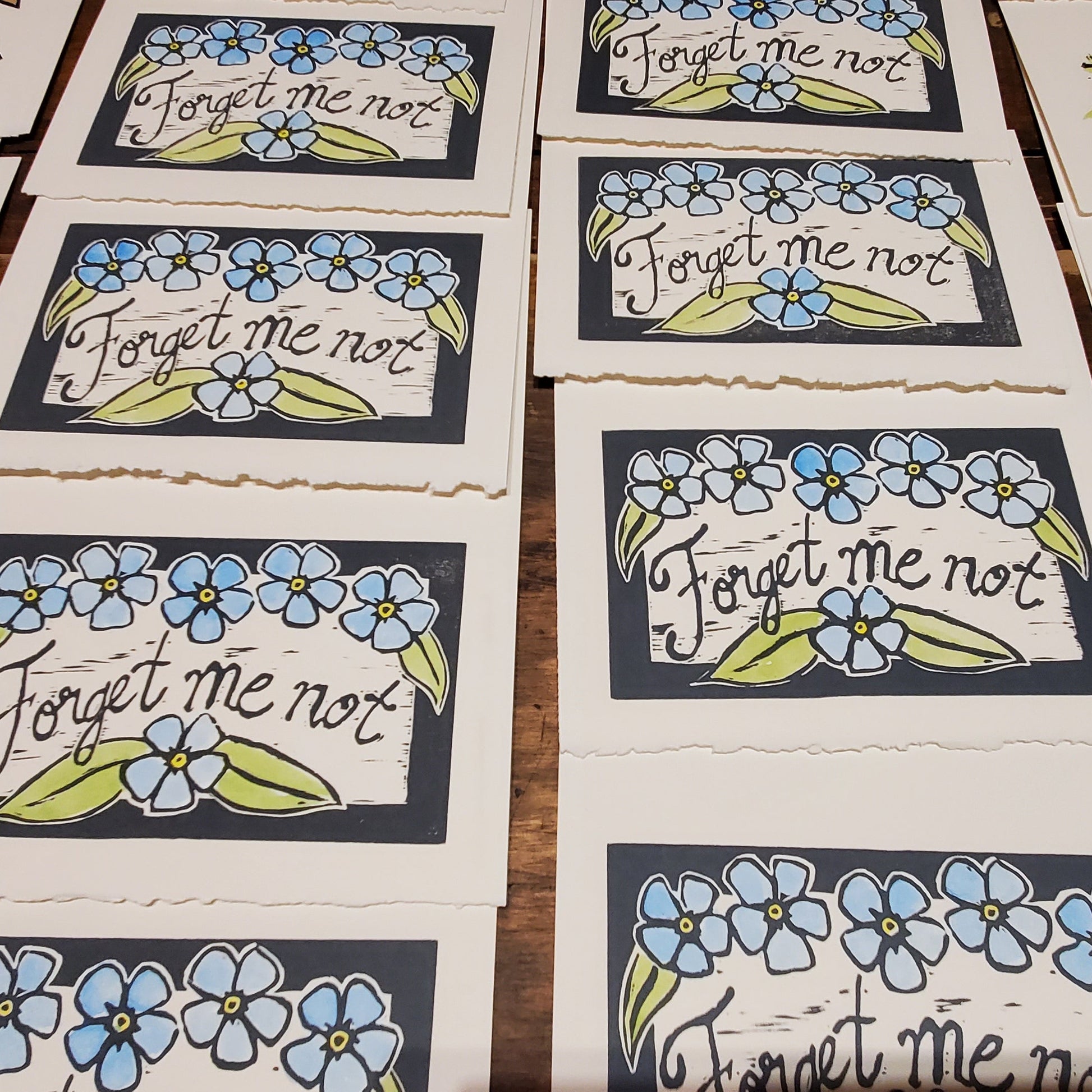 Forget-me-not cards in production at Norton's Cove Studio 2023