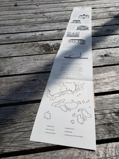 Wesleyville book laid flat on wharf at Wesleyville with map unfolded